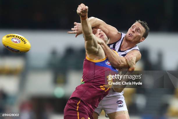 Stefan Martin of the Lions and Jonathon Grffin of the Dockers compete for the ball during the round 12 AFL match between the Brisbane Lions and the...