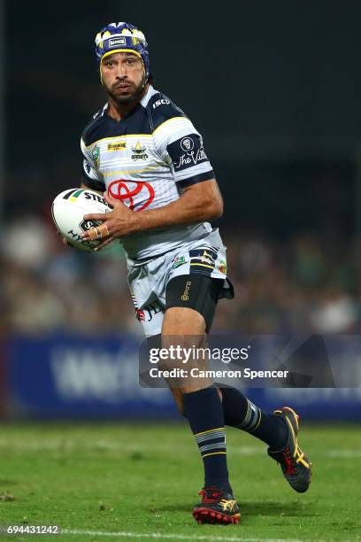 Johnathan Thurston of the Cowboys runs the ball during the round 14 NRL match between the Parramatta Eels and the North Queensland Cowboys at TIO...