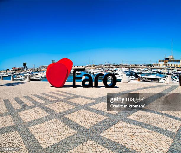 centre of faro city on hot summer day. - faro city portugal foto e immagini stock