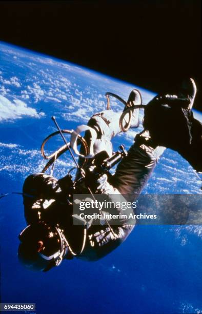 Astronaut Ed White II makes the first space walk during the Gemini 4 mission, June 3, 1965.