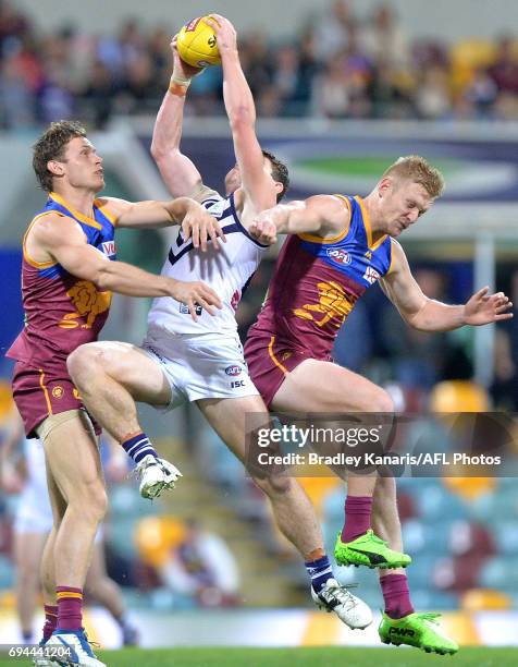 Lachie Neale of the Dockers takes a mark during the round 12 AFL match between the Brisbane Lions and the Fremantle Dockers at The Gabba on June 10,...