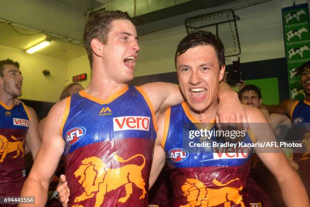 Lions players celebrate victory after the round 12 AFL match between the Brisbane Lions and the Fremantle Dockers at The Gabba on June 10, 2017 in...