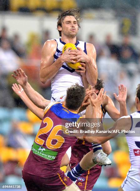 Joel Hamling of the Dockers takes a mark during the round 12 AFL match between the Brisbane Lions and the Fremantle Dockers at The Gabba on June 10,...