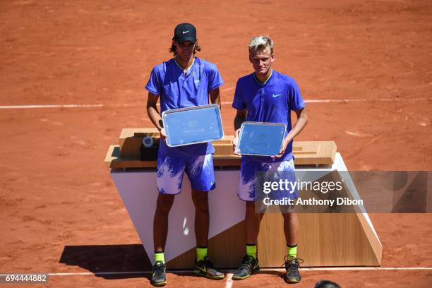 Alexei Popyrin of Australia and Nicola Kuhn of Spain during the day 14 of the French Open at Roland Garros on June 10, 2017 in Paris, France.