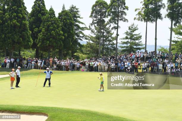 Ai Miyazato of Japan celebrates after making her birdie putt on the 14th hole during the third round of the Suntory Ladies Open at the Rokko Kokusai...