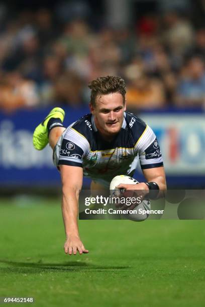Coen Hess of the Cowboys scores a try during the round 14 NRL match between the Parramatta Eels and the North Queensland Cowboys at TIO Stadium on...