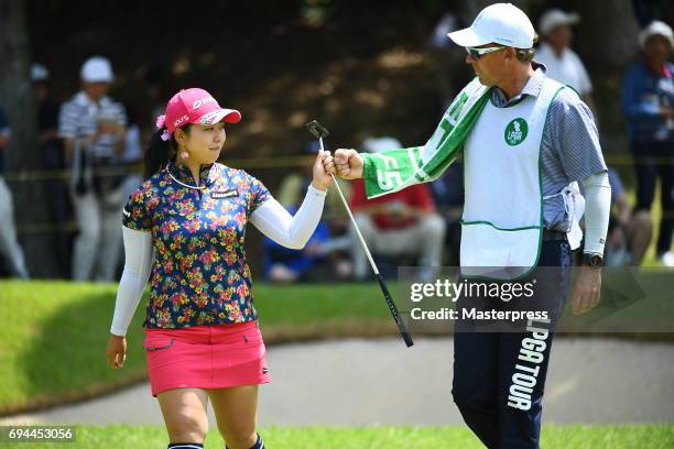 Saki Takeo of Japan celebrates after making her birdie putt on the 1st green during the third round of the Suntory Ladies Open at the Rokko Kokusai...