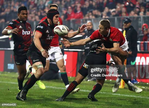 Liam Williams of the Lions spills the ball as Richie Mounga tackles during the match between the Crusaders and the British & Irish Lions at AMI...