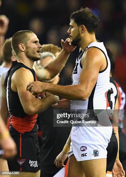 Patrick Ryder of the Power shakes hands with David Zaharakis of the Bombers during the round 12 AFL match between the Essendon Bombers and the Port...