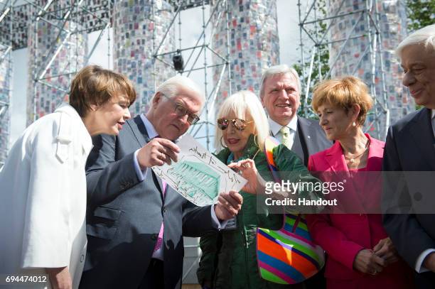 In this handout photo provided by the German Government Press Office , Federal President Frank-Walter Steinmeier his wife Elke Buedenbender and...