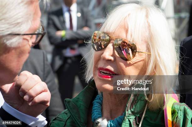 In this handout photo provided by the German Government Press Office , Federal President Frank-Walter Steinmeier talks to Argentine conceptual artist...