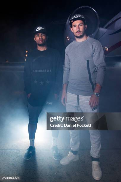 Douglas Costa of Brazil and Mathew Leckie of Australia pose for a photo during the Nike 'No Turning Back' Fan Meet & Greet at Hangar 85 on June 10,...