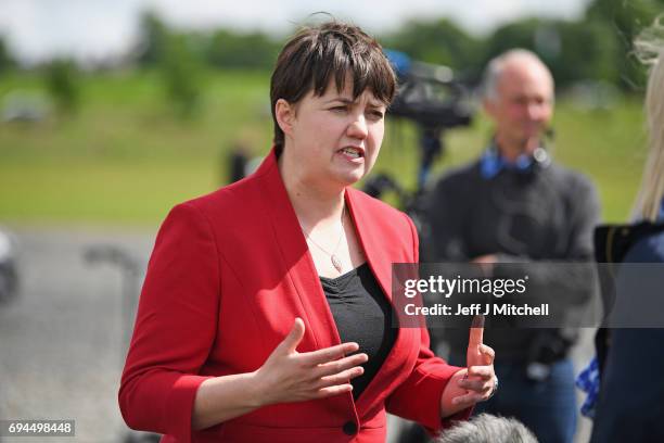 Scottish Conservative leader Ruth Davidson talks with the media following meeting with her newly elected members of parliament with the backdrop of...