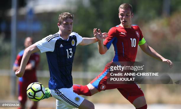 Czech' Republic forward Onderj Sasinka vies with Scotland's midfielder Iain Wilson during the Under 21 international football third place match Czech...