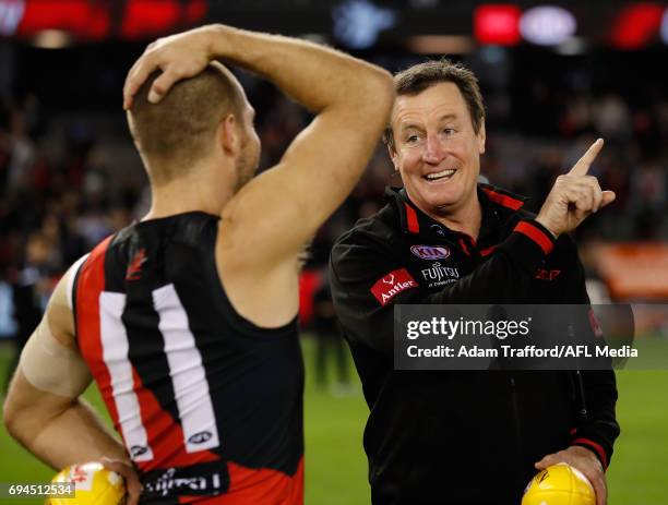 John Worsfold, Senior Coach of the Bombers celebrates with David Zaharakis of the Bombers during the 2017 AFL round 12 match between the Essendon...