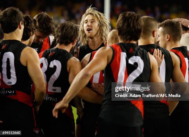 Dyson Heppell of the Bombers addresses his teammates during the 2017 AFL round 12 match between the Essendon Bombers and the Port Adelaide Power at...