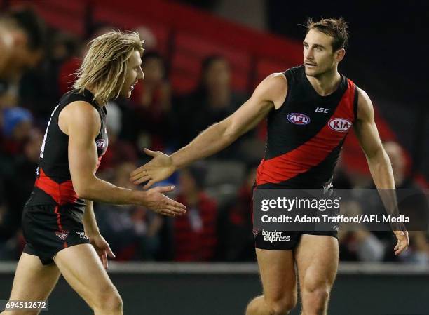 Jobe Watson of the Bombers celebrates his first goal since returning to AFL with Dyson Heppell of the Bombers during the 2017 AFL round 12 match...