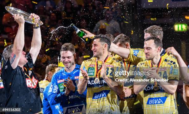 Head coach Nikolaj Jacobsen of Rhein Neckar Loewen, Alexander Petersson of Rhein Neckar Loewen and Patrick Groetzki of Rhein Neckar Loewen celebrate...