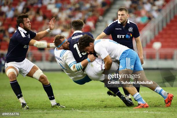 Tommaso Boni of Italy tackles Duncan Taylor of Scotland during the International Test match between Italy and Scotland at Singapore Sports Stadium on...