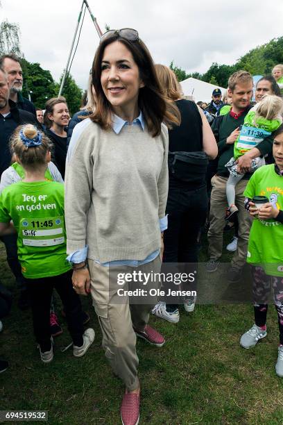 Crown Princess Mary of Denmark during the 'Children's Relay Run' in Faelledparken on June 10, 2017 in Copenhagen, Denmark. The kids relay run is part...