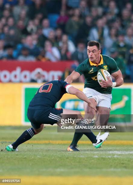 South Africa's centre Jesse Kriel is tackled by France's fly-hlaf Jules Plisson during the first rugby union Test match between South Africa and...