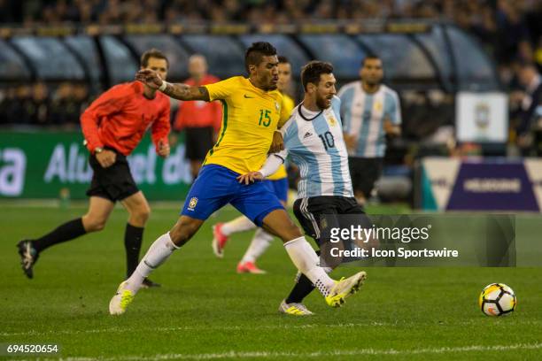Lionel Messi of the Argentinan National Football Team and Jose Paulo Marcela Junior of the Brazilian National Football Team contest the ball during...