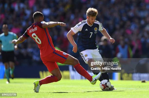 Jake Livermore of England tackles Stuart Armstrong of Scotland during the FIFA 2018 World Cup Qualifier between Scotland and England at Hampden Park...