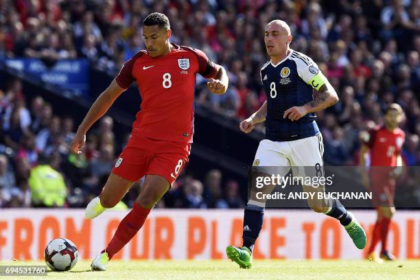 England's midfielder Jake Livermore vies with Scotland's midfielder Scott Brown during the group F World Cup qualifying football match between...