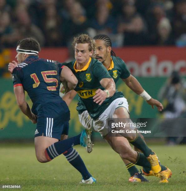 Brice Dulin of France tackled by Andries Coetzee of the Springboks during the Castle Lager Incoming Series 1st Test between South Africa and France...