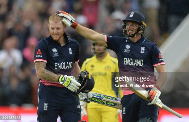 Ben Stokes of England celebrates reaching his century with Jos Buttler during the ICC Champions Trophy match between England and Australia at...