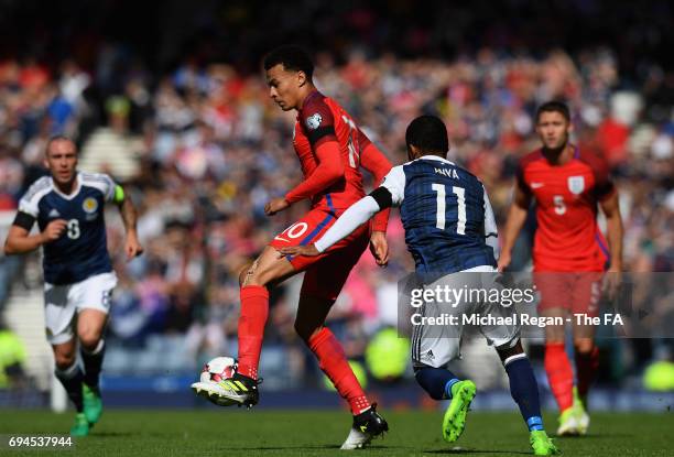Dele Alli of England controls the ball while under pressure from Ikechi Anya of Scotland during the FIFA 2018 World Cup Qualifier between Scotland...