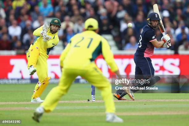 Jos Buttler of England plays behind point as wicketkeeper Matthew Wade looks on during the ICC Champions Trophy match between England and Australia...