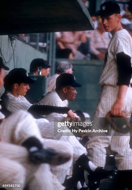 Elston Howard of the New York Yankees sits in the dugout during an MLB Spring Training game against the Chicago White Sox circa March, 1956 in St....