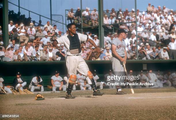 Catcher Elston Howard of the New York Yankees throws the ball to his pitcher during an MLB Spring Training game against the Chicago White Sox on...