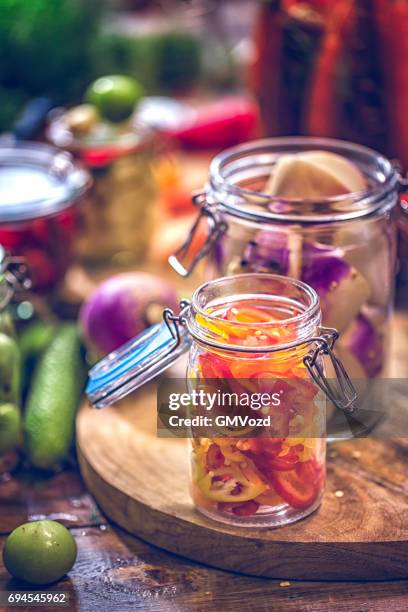 preserving organic vegetables in jars - pickle relish stock pictures, royalty-free photos & images