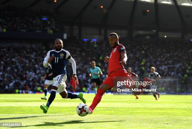 Ryan Bertrand of England crosses the ball as Ikechi Anya of Scotland attempts to block during the FIFA 2018 World Cup Qualifier between Scotland and...