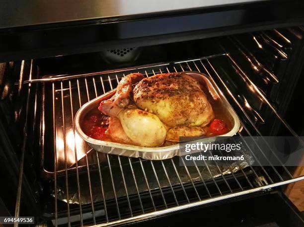 homemade roasted chicken in oven whit spices. - chicken roasting oven stock pictures, royalty-free photos & images