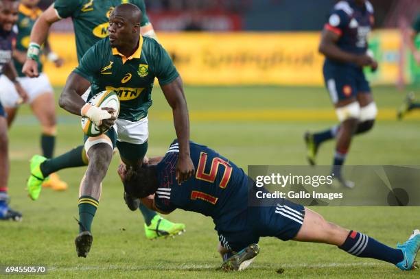 Raymond Rhule of the Springboks tackled by Brice Dulin of the French during the Castle Lager Incoming Series 1st Test between South Africa and France...