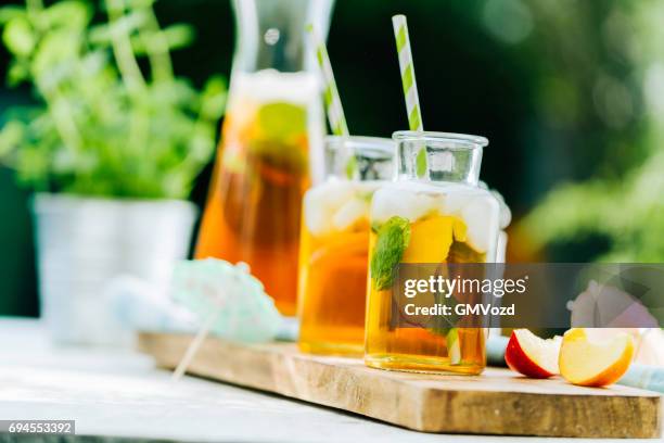 peach ice tea - ice tea stock pictures, royalty-free photos & images