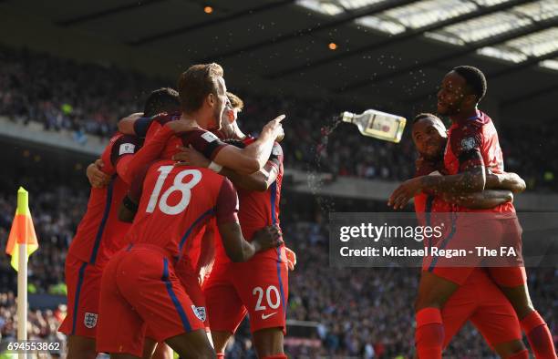 Harry Kane of England celebrates scoring his sides second goal with his team mates during the FIFA 2018 World Cup Qualifier between Scotland and...