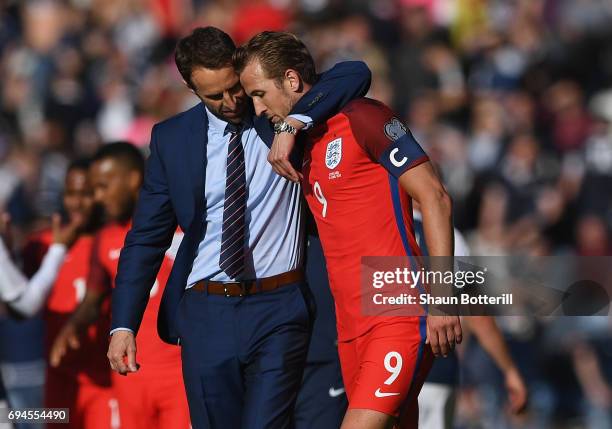 Gareth Southgate, Manager of England and Harry Kane of England embrace after the FIFA 2018 World Cup Qualifier between Scotland and England at...