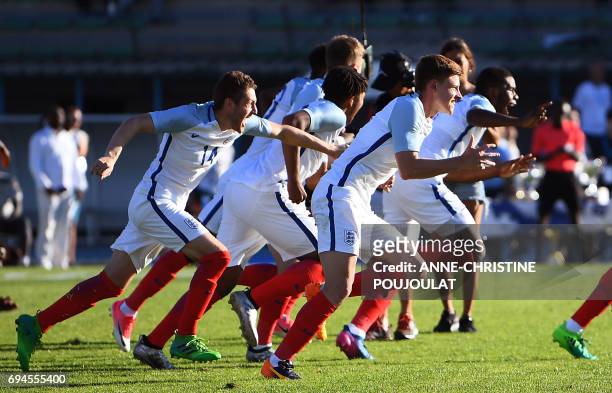 England's players celebrate after winning the Under 21 international football final match England vs Ivory Coast, at the De Lattre Stadium in...