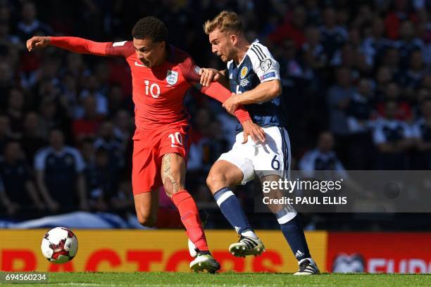 England's midfielder Dele Alli vies with Scotland's midfielder James Morrison during the group F World Cup qualifying football match between Scotland...