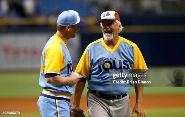 Former major-league pitcher Bill Lee speaks with Alex Cobb of the Tampa Bay Rays after throwing out the ceremonial first pitch before the start of...