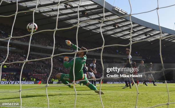 Alex Oxlade-Chamberlain of England scores his sides first goal past Craig Gordon of Scotland during the FIFA 2018 World Cup Qualifier between...