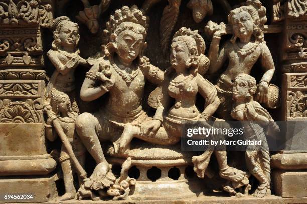 an intricate sculpture depicting hindi deities at the harshat mata temple in the village of abhaneri, rajasthan, india - abhaneri stock-fotos und bilder