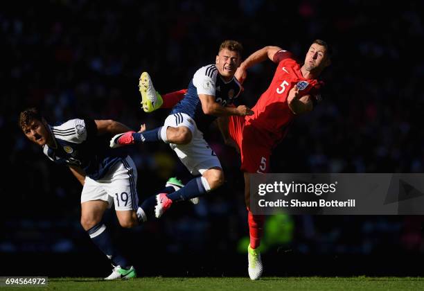 Chris Martin of Scotland and Ryan Fraser of Scotland battle for possession with Gary Cahill of England during the FIFA 2018 World Cup Qualifier...