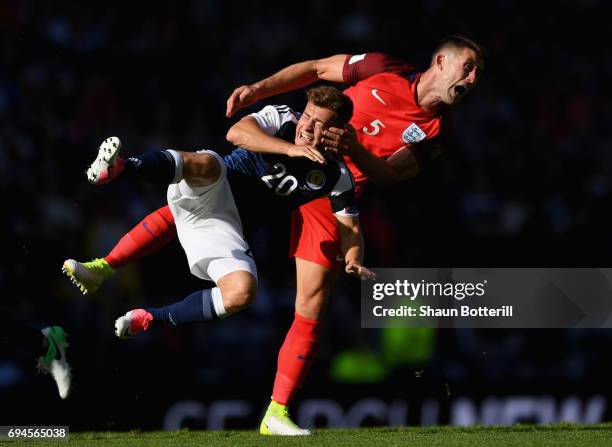 Ryan Fraser of Scotland and Gary Cahill of England battle for possession during the FIFA 2018 World Cup Qualifier between Scotland and England at...