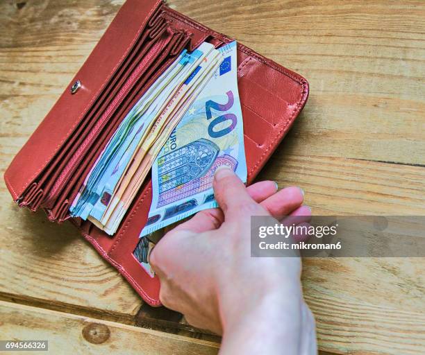 stealing money from wallet - brieftasche stock-fotos und bilder