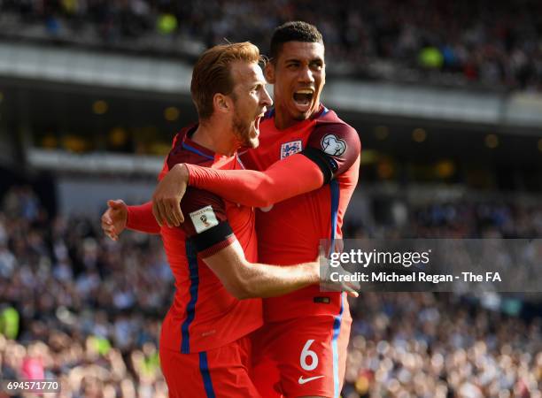 Harry Kane of England celebrates scoring his sides second goal with Chris Smalling of England during the FIFA 2018 World Cup Qualifier between...